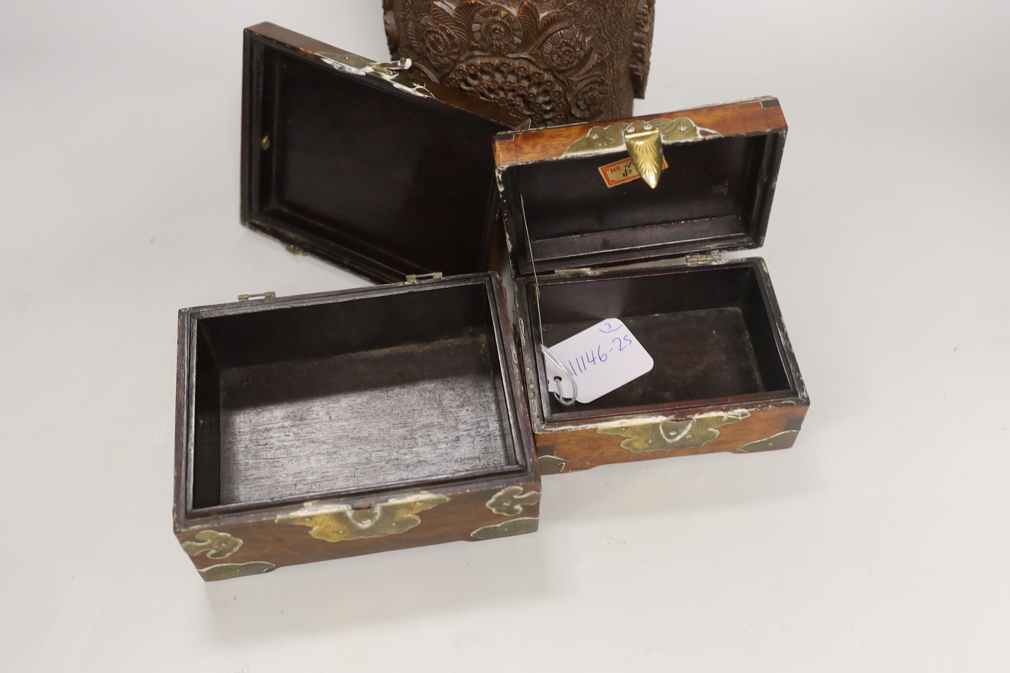 An Indian carved wood humidor and two Chinese brass mounted boxes, tallest 22cm high